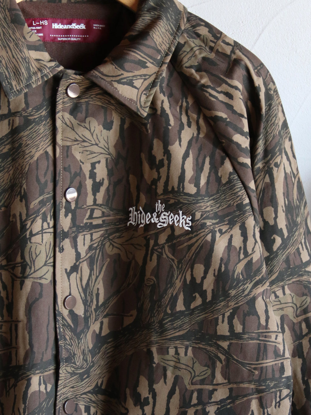 【2026年10月10日 12時から販売開始】HideandSeek×Toru Nishiura / The H&S Team Jacket (Camo) / H30th-091326c